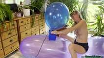 topless inflating balloons with the pump and popping them with the lighter