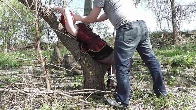 Sina tied to tree