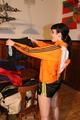 Jill wearing a sexy black nylon shorts and a orange rain jacket while dressing her up (Pics)