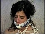26 Yr OLD K-MART CLERK IS RING-GAGGED, BALL-TIED, IS RING GAGGED, MOUTH STUFFED, BIKINI TOP GAGGED, BALL-GAGGED, ACE BANDAGE GAGGED, BLINDFOLDED, TOE-TIED & DROOLING WHILE SITTING BALL-TIED AND NAKED ON THE FLOOR (D65-2)