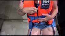 Sexy Jill shows you how to enjoy putting on and wear a lifevest over an bikini and a shiny nylon shorts (Video)