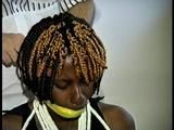 21 Yr OLD BLACK COLLEGE STUDENT GETS MOUTH STUFFED, WRAP TAPE GAGGED WHILE TIED TO A CHAIR  WEARING BLACK LINGERIE, GARTER BELT & HIGH HEELS (D65-4)