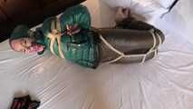 Rachel Adams tied and gagged in shiny Downwear