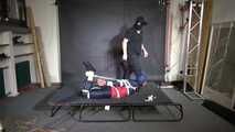 Marie bound and gagged in shiny nylon Rainwear
