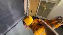 Marie tied and gagged in shiny nylon rainwear