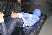 ***SEXY SANDRA*** wearing a supersexy skinny shiny nylon pants and a lightblue shiny nylon rain jacket being bound on a sofa with ropes and a ball gag (Pics)
