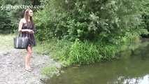 119018 Donna-Jo Takes A Relaxed Pee Into The Small Stream.