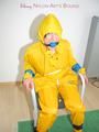 Katharina tied, gagged and hooded on a chair wearing sexy yellow rainwear (Pics)