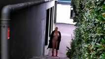 Fur coat and rubber boots - naked in the park