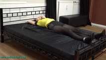 Nina heavyly cuffed to the bed