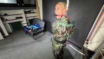 Ms Ungeniert tied and gagged in shiny nylon Rainwear 