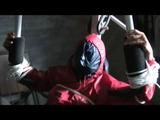02:50 Min. video with Katharina tied and gagged in shiny nylon rainwear