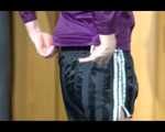Pia trying on several shiny nylon shorts and rain jackets (Video)