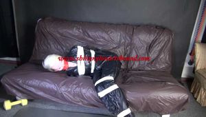***NEW MODELL COURTNEY*** wearing a sexy black shiny nylon rain pant and a a black rain jacket being tied and gagged with tape and a ballgag on a sofa (Video)