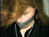 DOLL FACE APRIL TAPES UPS, GAGS & HANDCUFFS HERSELF (D20-11)