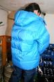 Jill tied and gagged in a refrigeration room wearing a blue shiny nylon down jacket and a black rain pants (Pics)