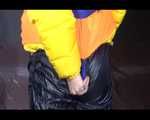 Sexy Mara trying on her new yellow down jacket and her lifevest in combination with a sexy shiny black rain pants and rubber boots (Video)