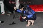 Watching sexy Destiny cleaning up the studio with the vaccuum cleaner wearing a sexy black shiny nylon rain pant and a blue down jacket (Pics)