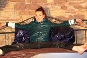 Mara tied and gagged on a princess bed in an old cellar wearing an supersexy shiny green down jacket and a rain pants (Pics)