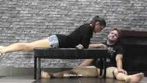 Viktoria rests on the slave's balls and blows smoke into his mouth