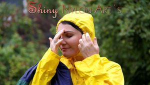 Jill Diamond in the garden playing with water out of the garden hose wearing supersexy shiny nylon rainwear and a rain cape (Pics)