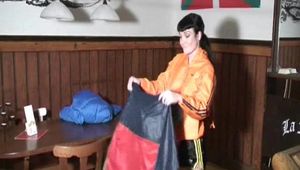 Jill Diamond wearing a sexy shiny nylon shorts and a rain jacket traing on other shorts and jackets (Video)