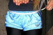Katharina tied and gagged in shiny nylon shorts
