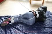 Nina tied and gagged in a shiny downjacket and rainpants