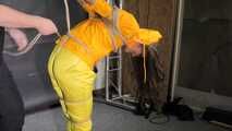 Marie tied and gagged in shiny nylon rainwear