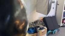 See Lady M, bound in shiny yellow Rainsuit, wearing a latex Mask and a Gasmask