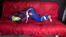 SANDRA being tied and gagged on a sofa with ropes and a clothgag wearing a sexy blue shiny nylon rain pants and a purple rain jacket  (Video)