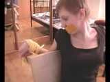 Alice Lee - Dress-wearing beauty gets tied to a table and escapes (video)
