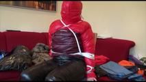 Jill tied, gagged and hooded on a chair wearing two downjackets for breath control play (Video)