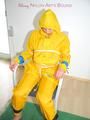 Katharina tied, gagged and hooded on a chair wearing sexy yellow rainwear (Pics)
