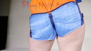 Watching Jill wearing a sexy lightblue shiny nylon shorts and a bra while putting on a lifevest (Pics)