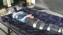 Myxxxy bound and gagged in shiny nylon Rainwear trying to free herself