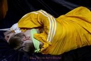 Samanthy bound and gagged in shiny nylon rainwear