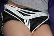Pia being tied and gagged on a sofa with ropes and a cloth gag wearing a sexy shiny nylon shirts and a tshirt (Pics)