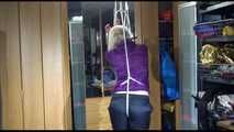 Pia tied with ropes overhead and gagged with a ballgag wearing sexy rain pants and a rain jacket (Video)