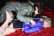 Watching sexy Sonja wearing a sexy shiny nylon shorts and a rain jacket being tied from Miss D with ropes (Pics)