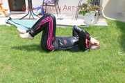 Mara ties and gagges herself in the garden with cuffs wearing a sexy new black/pink adidas suit (Pics)