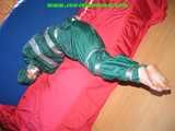 Get 548 Pictures with Jill tied and gagged in shiny nylon rainwear from 2005-2008!