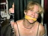 38 Yr OLD CASHIER IN BLACK LEATHER DRESS, TIED & GAGGED HOSTAGE (D22-14)