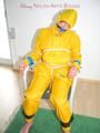 Katharina tied, gagged and hooded on a chair wearing sexy yellow rainwear (Pics)