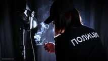 Police woman is smoking 3 strong reds in the studio