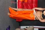 Watching Pia putting on a wonderful supersexy shiny nylon rainssuit in orange (Pics)