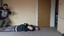 Hogtied in yellow ropes