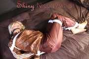 Watching sexy Sonja being tied and gagged on a bed with ropes and a clothgag wearing a supersexy shiny brown nylon pants and a brown rain jacket (Pics)