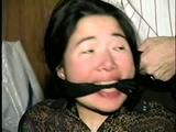 25 YEAR OLD ASIAN MAI-LING IS MOUTH STUFFED, CLEAVE GAGGED, HANDGAGGED, OTM GAGGED, TAPE GAGGED & TIGHTLY TIED TO A CHAIR  (D47-15)