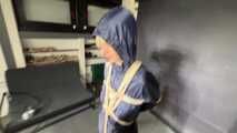 Myxxxy bound and gagged in a shiny nylon Rainsuit